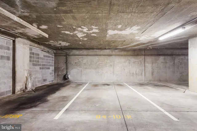 a living room with furniture a fireplace and a bookshelf