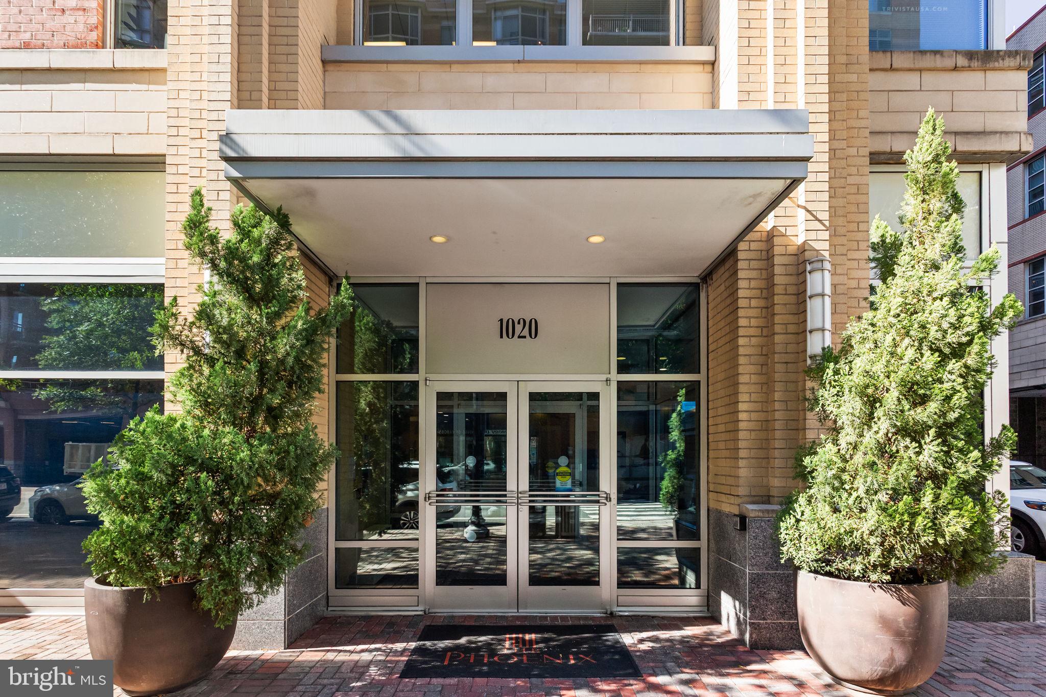 1020 North Highland Street, Unit 621 Arlington, VA 22201 - Photo 2 of 50 a potted plant sitting in front of a house