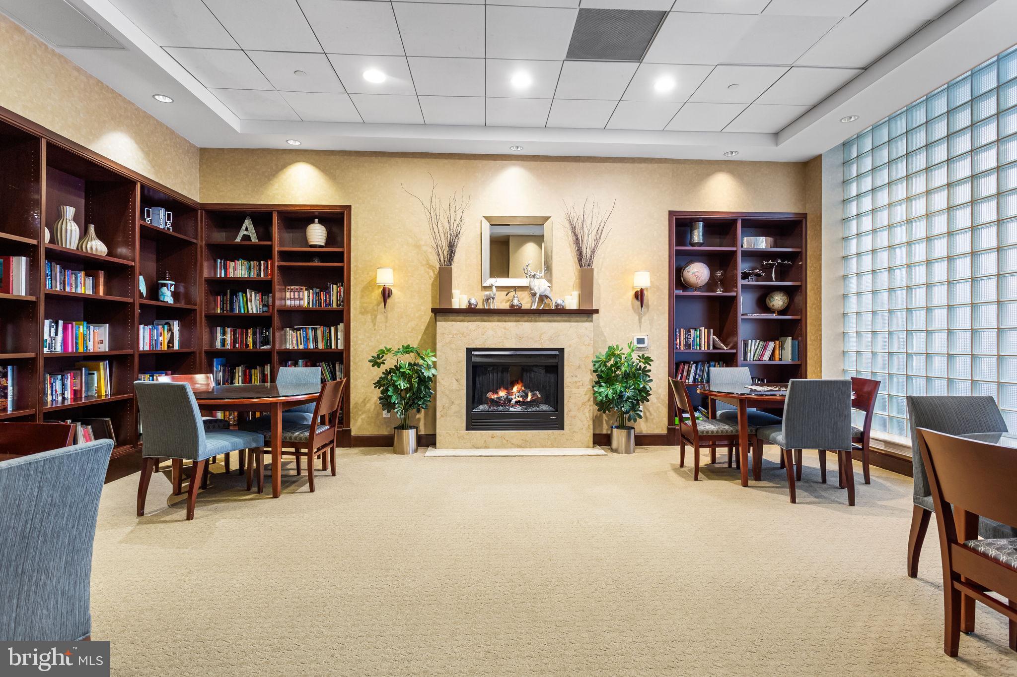 1020 North Highland Street, Unit 621 Arlington, VA 22201 - Photo 21 of 50 a living room with furniture a fireplace and a bookshelf