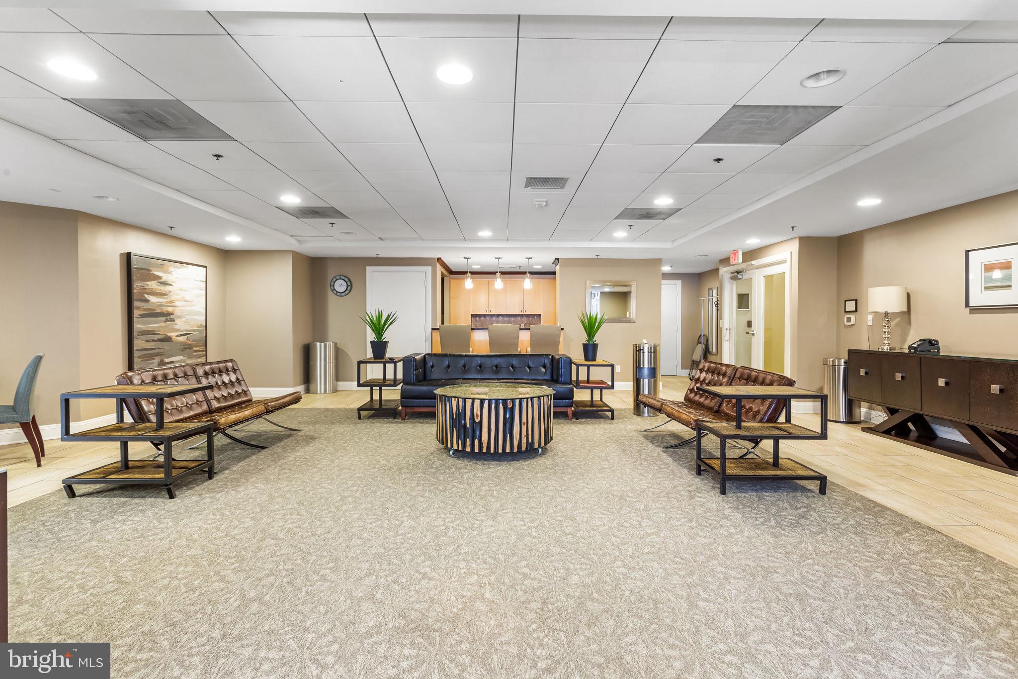 1020 North Highland Street, Unit 621 Arlington, VA 22201 - Photo 27 of 50 a living room with furniture and a table