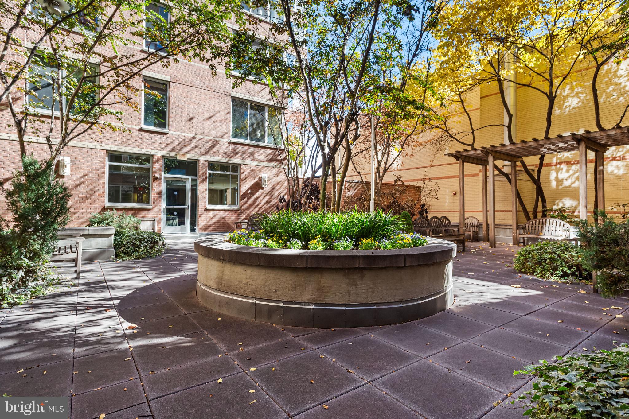 1020 North Highland Street, Unit 621 Arlington, VA 22201 - Photo 30 of 50 a view of a house with backyard and garden