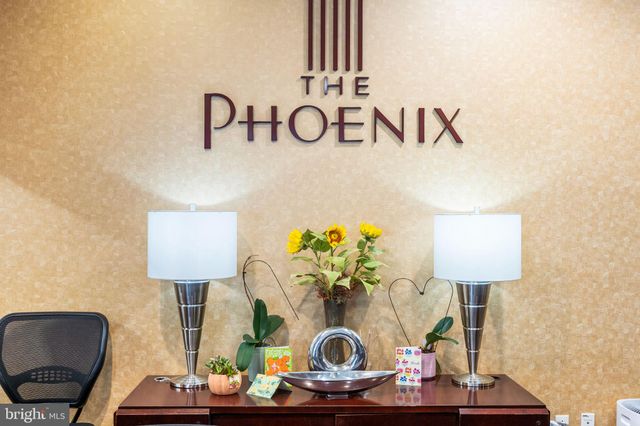 a table with a couch and a lamp on table