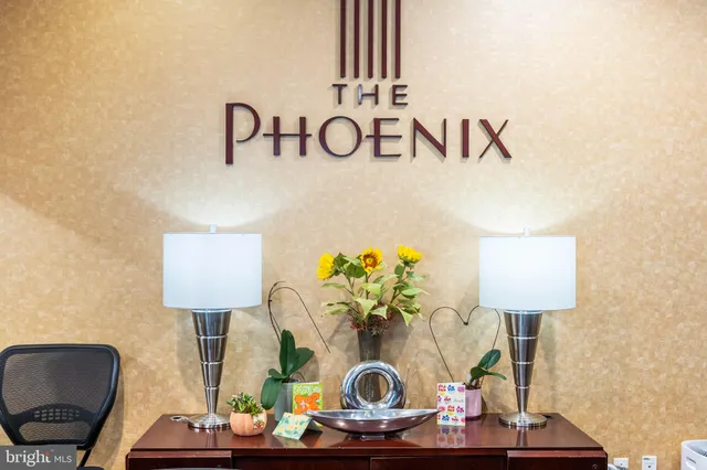 a table with a couch and a lamp on table