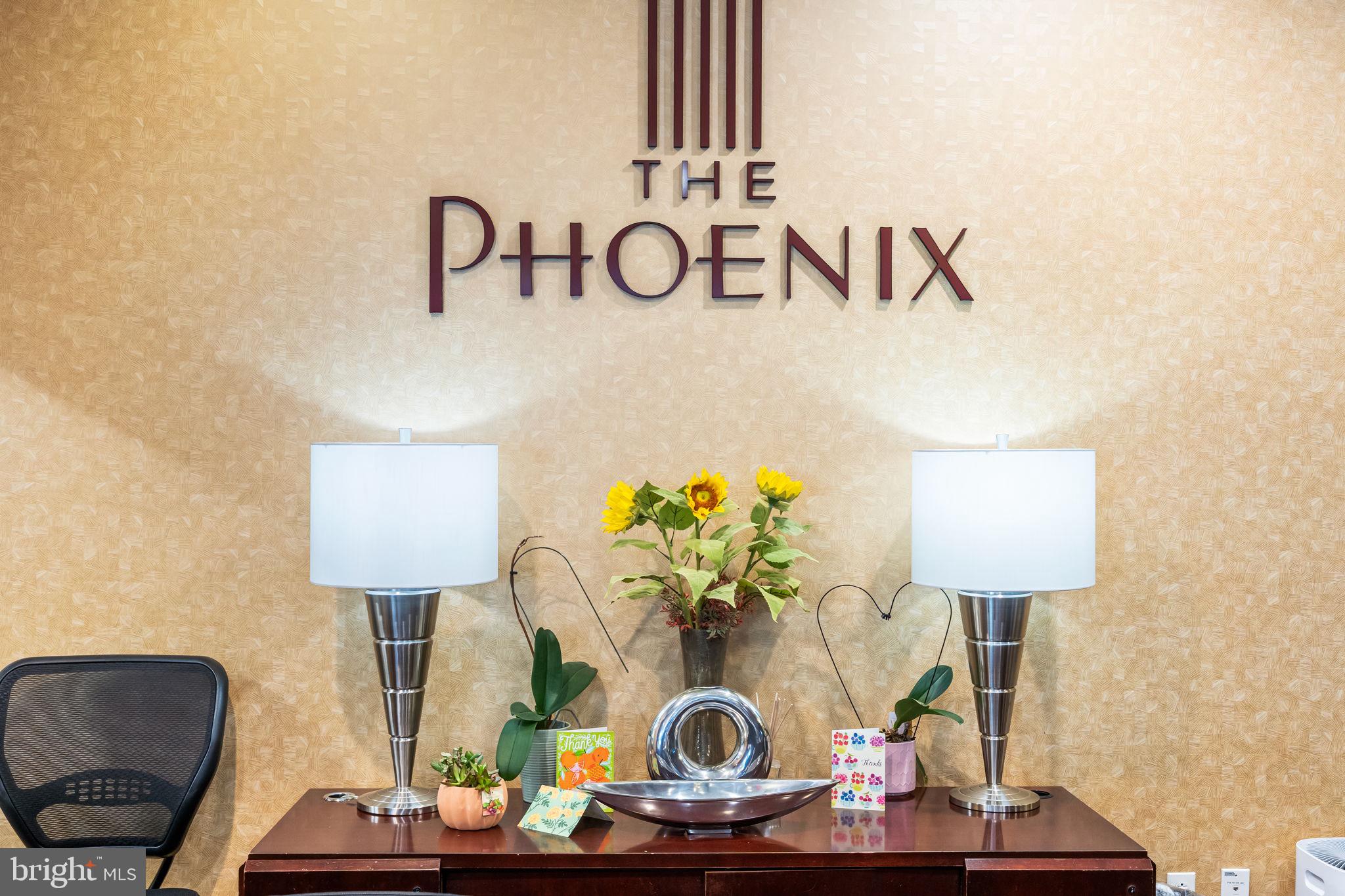 1020 North Highland Street, Unit 621 Arlington, VA 22201 - Photo 3 of 50 a table with a couch and a lamp on table