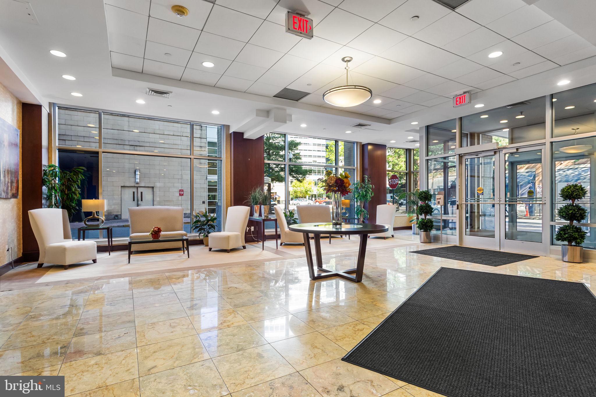 1020 North Highland Street, Unit 621 Arlington, VA 22201 - Photo 34 of 50 a living room with furniture and a large window