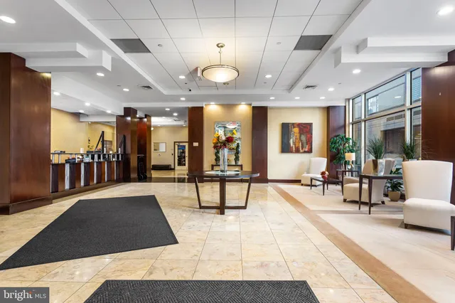 a view of a swimming pool with outdoor seating