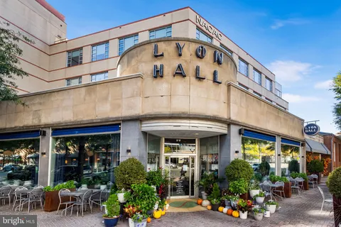 a view of a street with sitting area