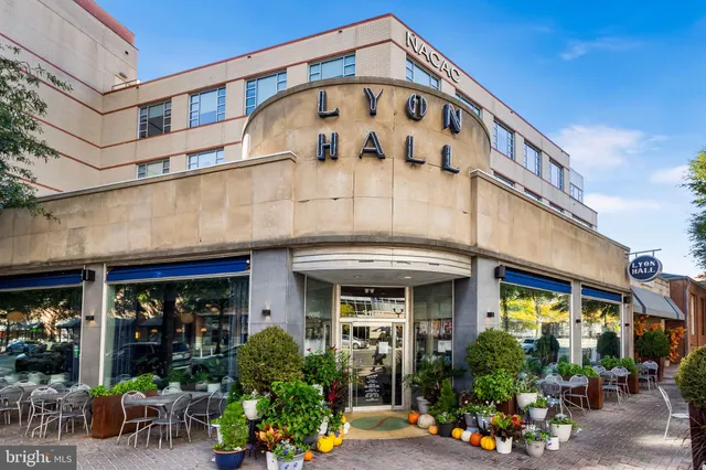 a view of a street with sitting area