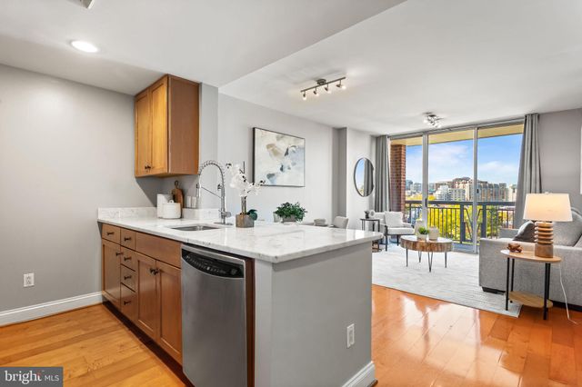 a view of living room with granite countertop furniture and a large window