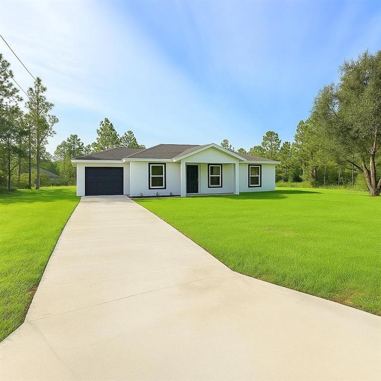 14427 Southwest 76th Ave Road Ocala, FL 34473 - Photo 1 of 1 a view of house with yard outdoor seating and green space