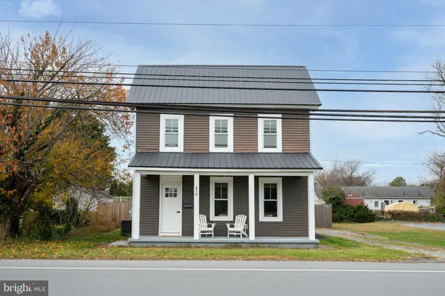 a view of house with a swimming pool