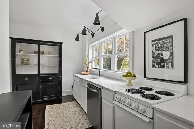 a kitchen with a stove and a sink