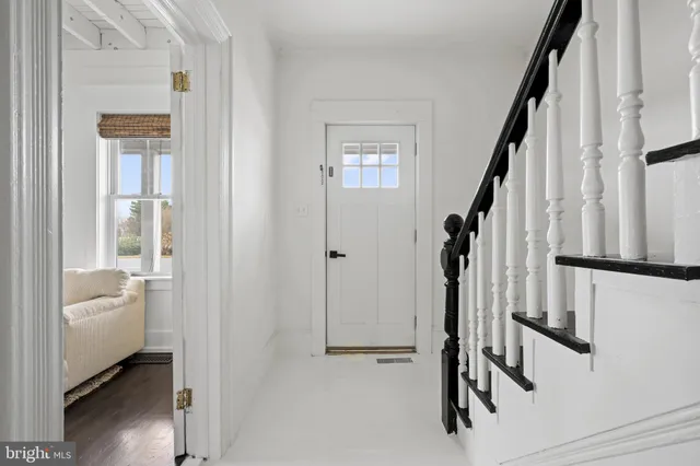 a view of a hallway with closet and garden