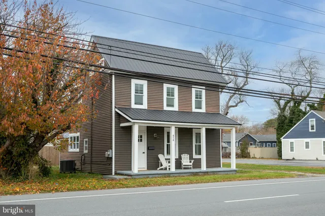 a view of a white building with a large windows