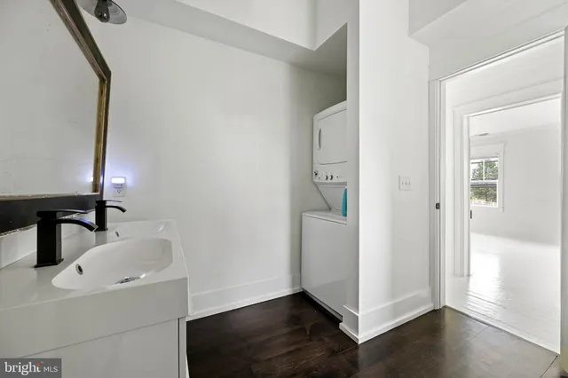 a bathroom with a sink and mirror
