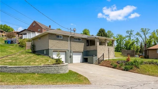 a aerial view of a house with a yard