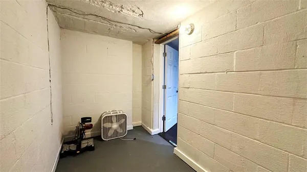 a bathroom with a toilet sink and shower