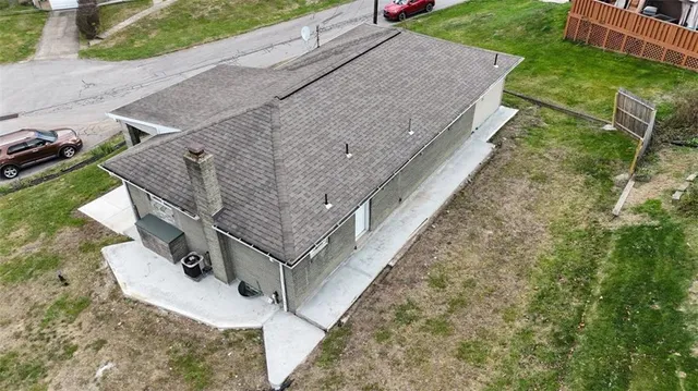 a aerial view of a house with a yard