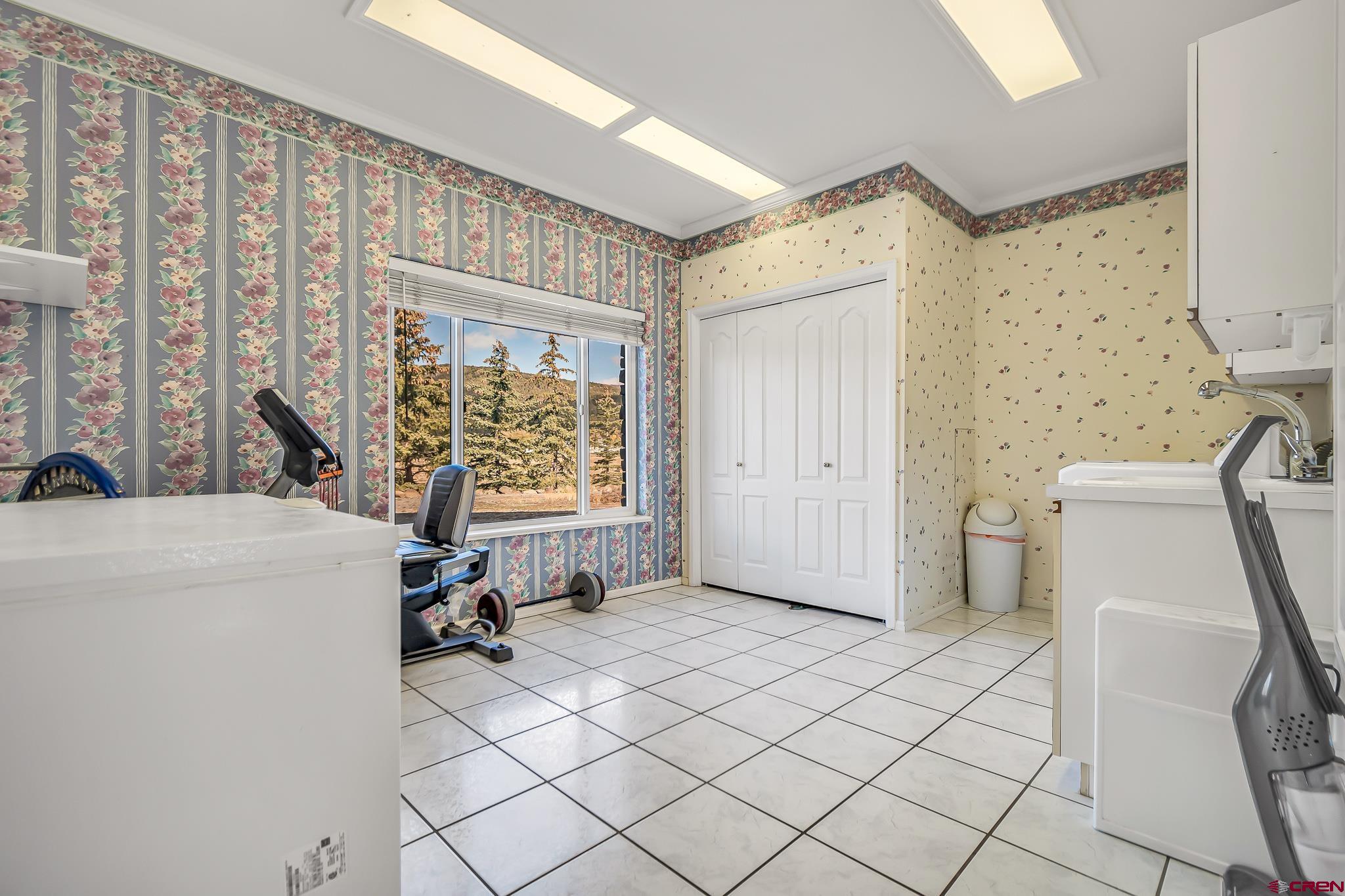 24344 Ute Trail Road Cedaredge, CO 81413 - Photo 17 of 33 a view of a storage & utility room with a window