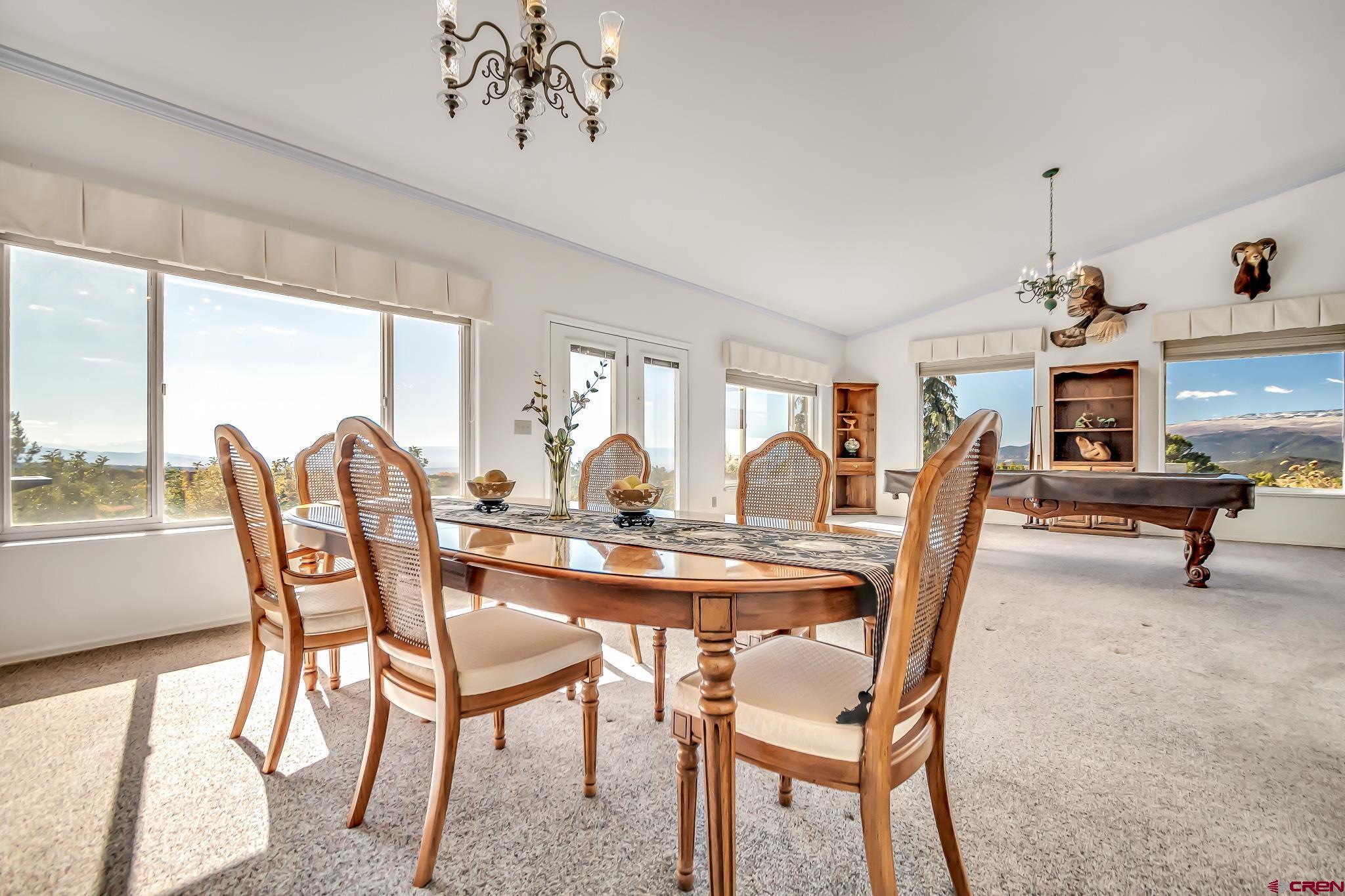 24344 Ute Trail Road Cedaredge, CO 81413 - Photo 18 of 33 a view of a dining room with furniture window and outside view