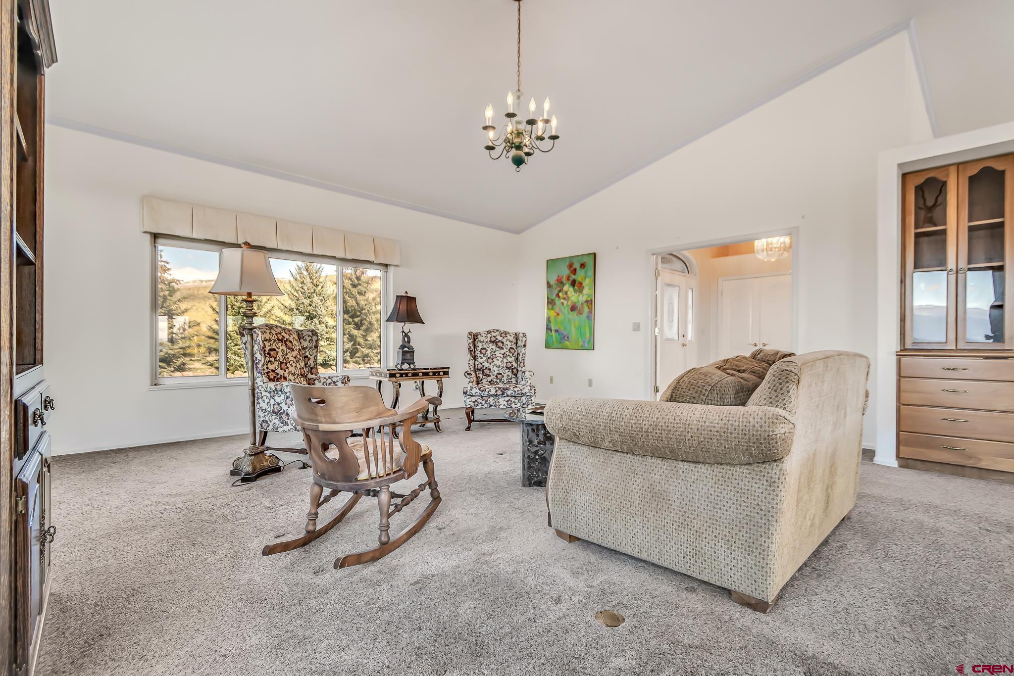 24344 Ute Trail Road Cedaredge, CO 81413 - Photo 20 of 33 a view of a livingroom with furniture and a large window