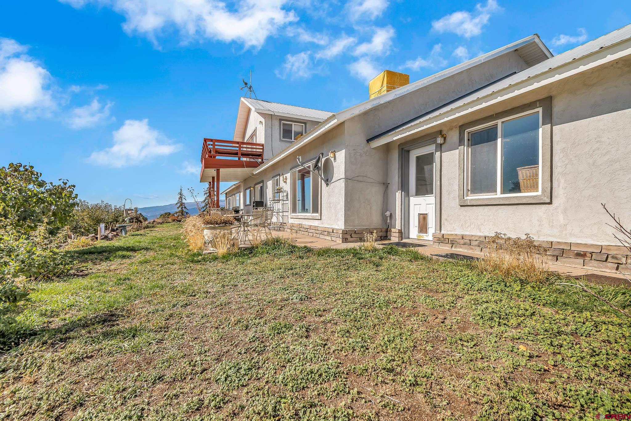 24344 Ute Trail Road Cedaredge, CO 81413 - Photo 6 of 33 a house view with a garden space