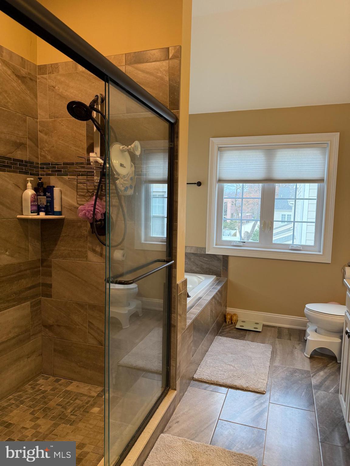 10 Harris Road Princeton, NJ 08540 - Photo 14 of 28 a bathroom with a tub and a shower