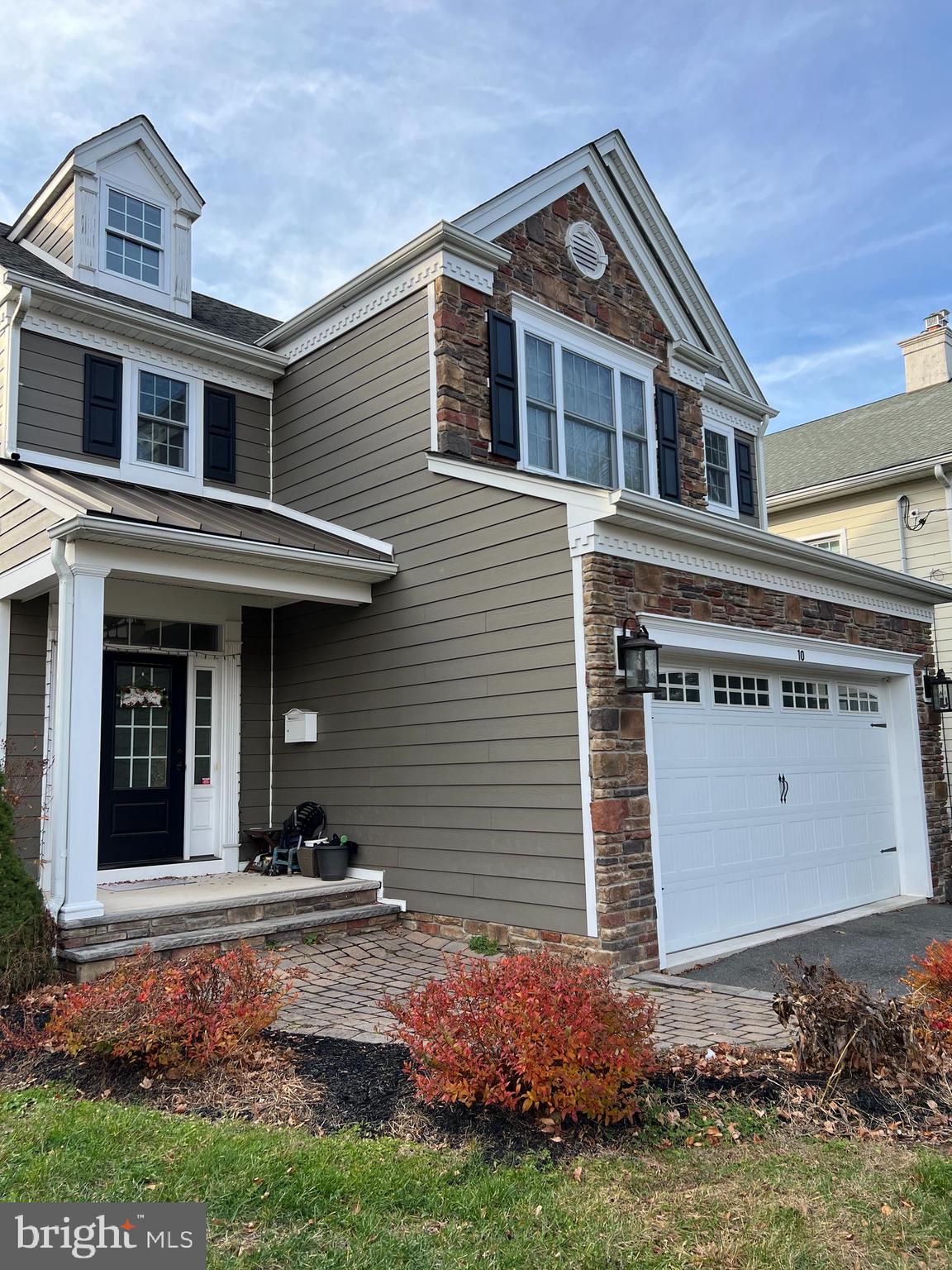 10 Harris Road Princeton, NJ 08540 - Photo 2 of 28 a front view of a house with garden