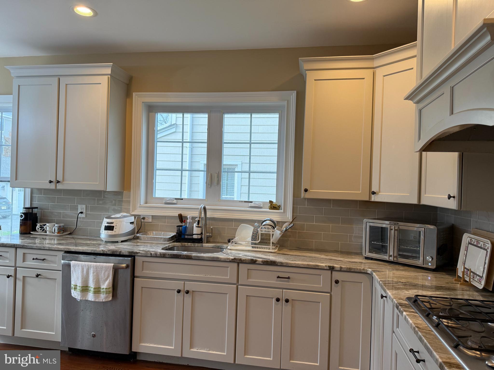 10 Harris Road Princeton, NJ 08540 - Photo 5 of 28 a kitchen with granite countertop a sink a stove and cabinets