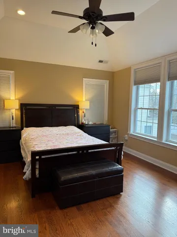 a bed sitting in a room next to a window