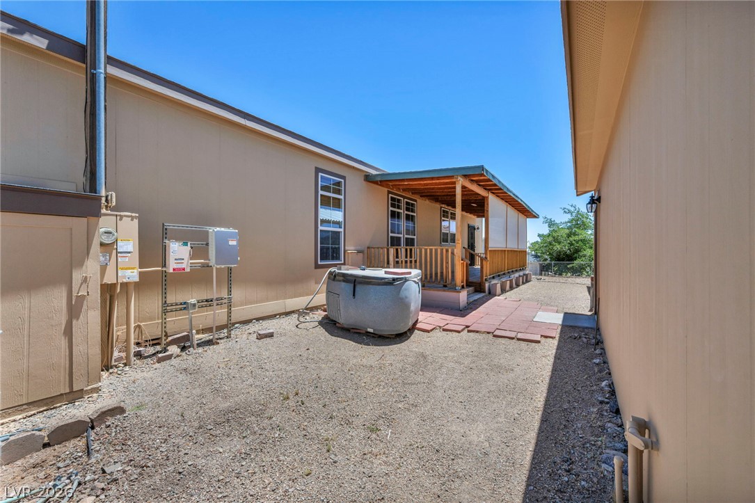 225 California Street Searchlight, NV 89046 - Photo 6 of 64 An inviting covered porch beckons to a private outdoor spa, perfect for relaxation.