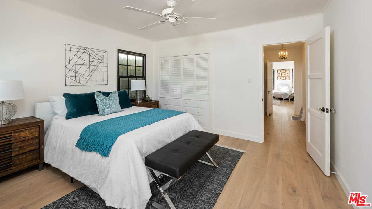 723 Crestmoore Place Venice, CA 90291 - Photo 13 of 33 a bedroom with a bed and wooden floor