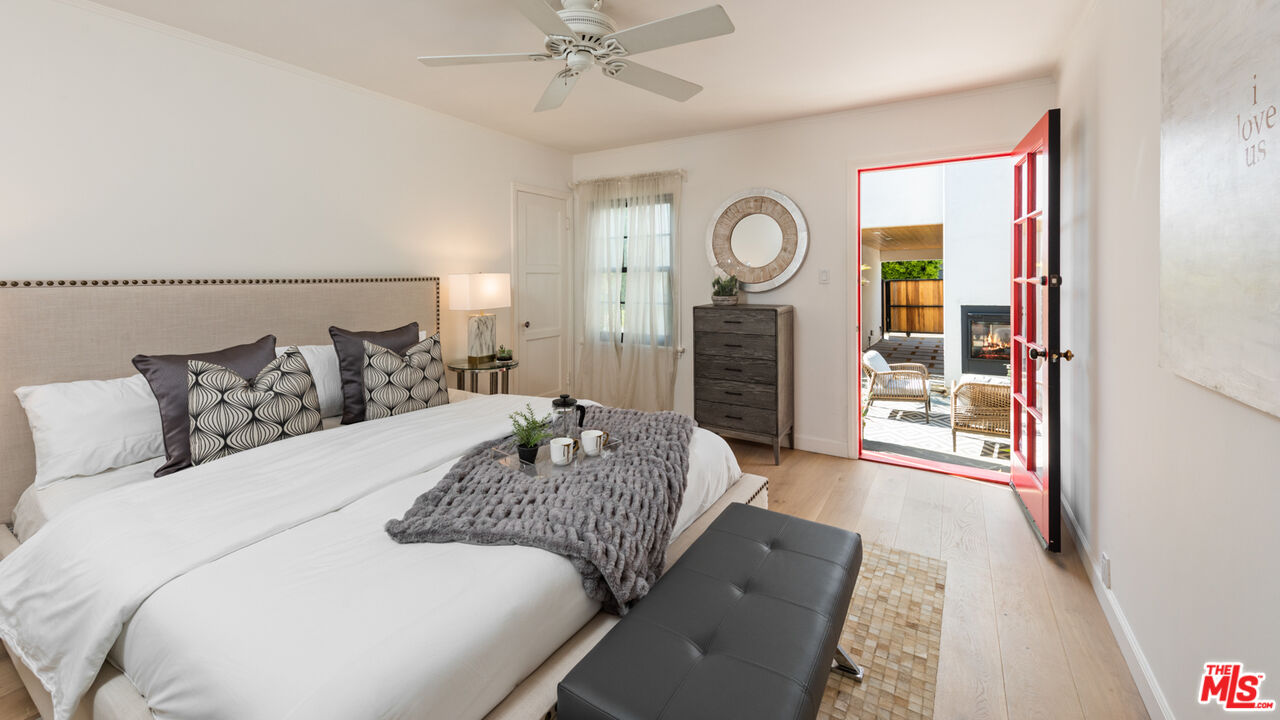 723 Crestmoore Place Venice, CA 90291 - Photo 16 of 33 a bedroom with a bed a mirror and a large window