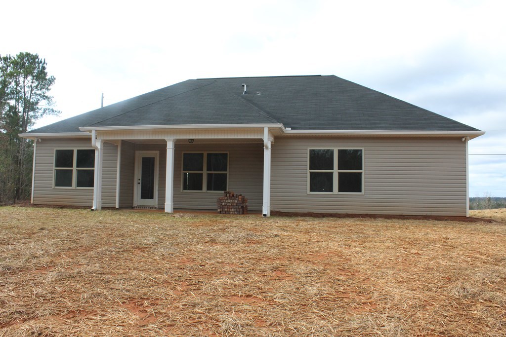 821 Weldon Road Forsyth, GA 31029 - Photo 8 of 8 a house that has a window in front of it