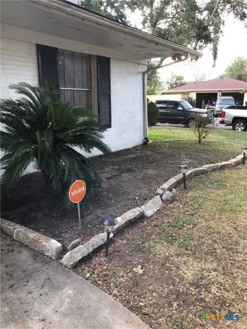 a view of a backyard of a house