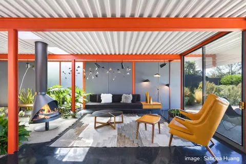 a front view of a house with garden