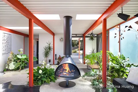 a large kitchen with a table and chairs in it