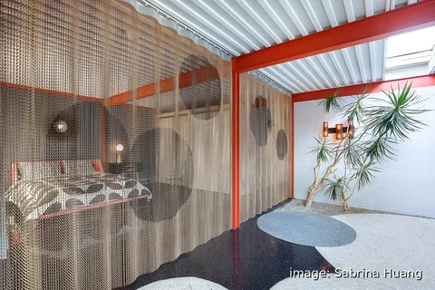 a workspace with furniture and a potted plant