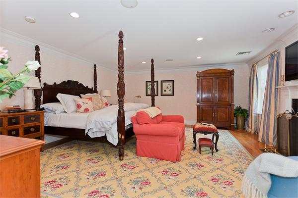 23 Slocum Road Lexington, MA 02421 - Photo 15 of 30 a bedroom with furniture and a chandelier