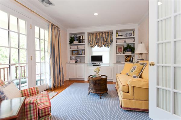 23 Slocum Road Lexington, MA 02421 - Photo 16 of 30 a bedroom with furniture and a flat screen tv