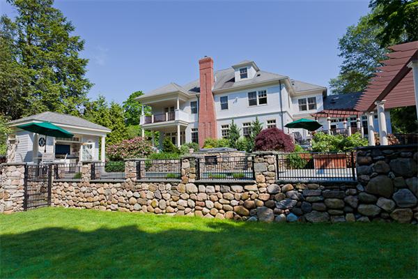 23 Slocum Road Lexington, MA 02421 - Photo 2 of 30 a front view of a house with a garden and plants