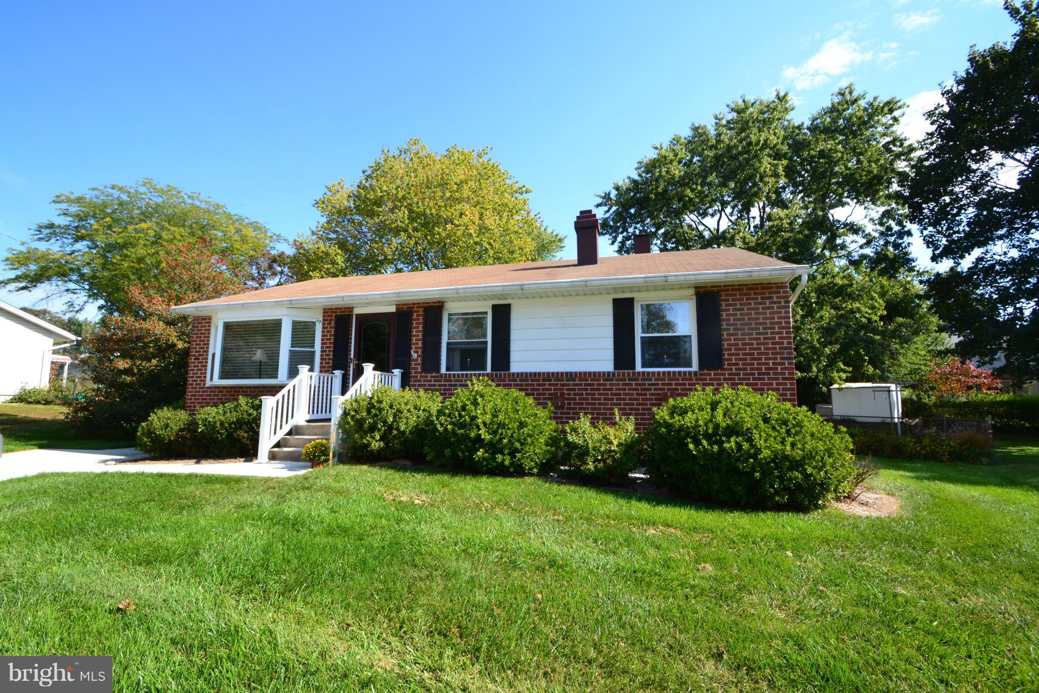 311 Bryanstone Road Reisterstown, MD 21136 - Photo 1 of 23 a view of a house with a yard and potted plants
