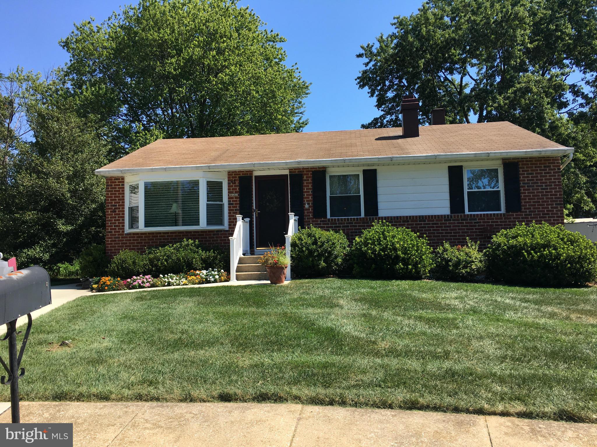 311 Bryanstone Road Reisterstown, MD 21136 - Photo 2 of 23 a front view of a house with a yard