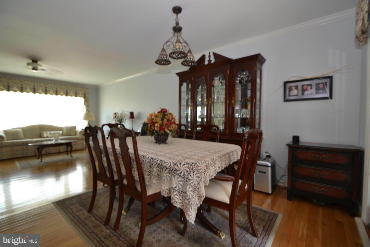 311 Bryanstone Road Reisterstown, MD 21136 - Photo 11 of 23 a view of a dining room with furniture window and wooden floor