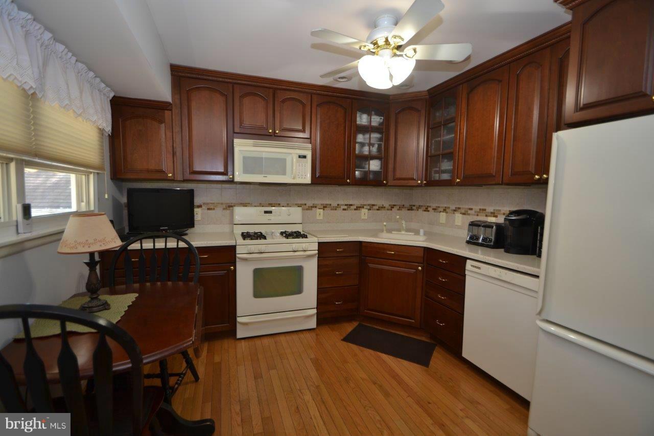 311 Bryanstone Road Reisterstown, MD 21136 - Photo 12 of 23 a kitchen with a stove window and cabinets