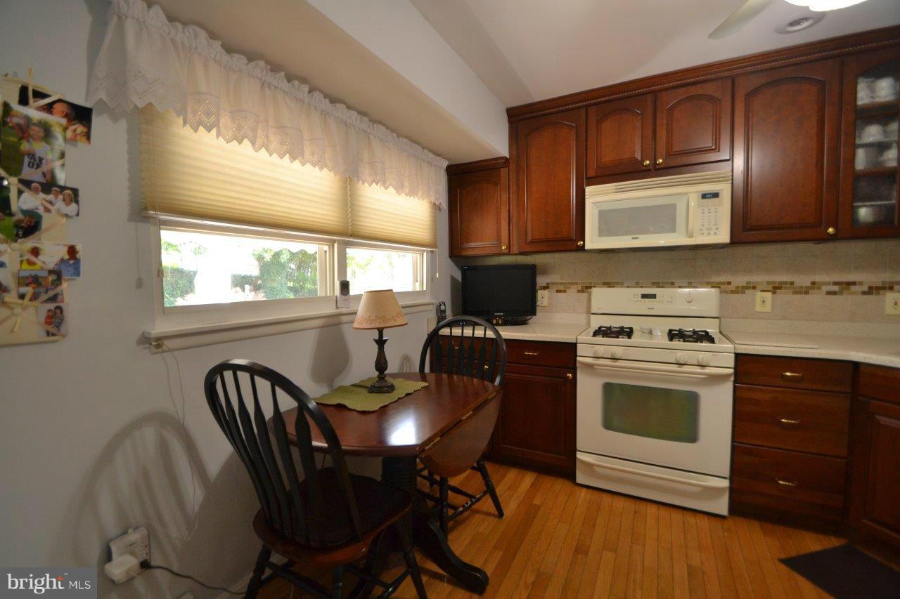 311 Bryanstone Road Reisterstown, MD 21136 - Photo 13 of 23 a kitchen with a stove a sink and a refrigerator