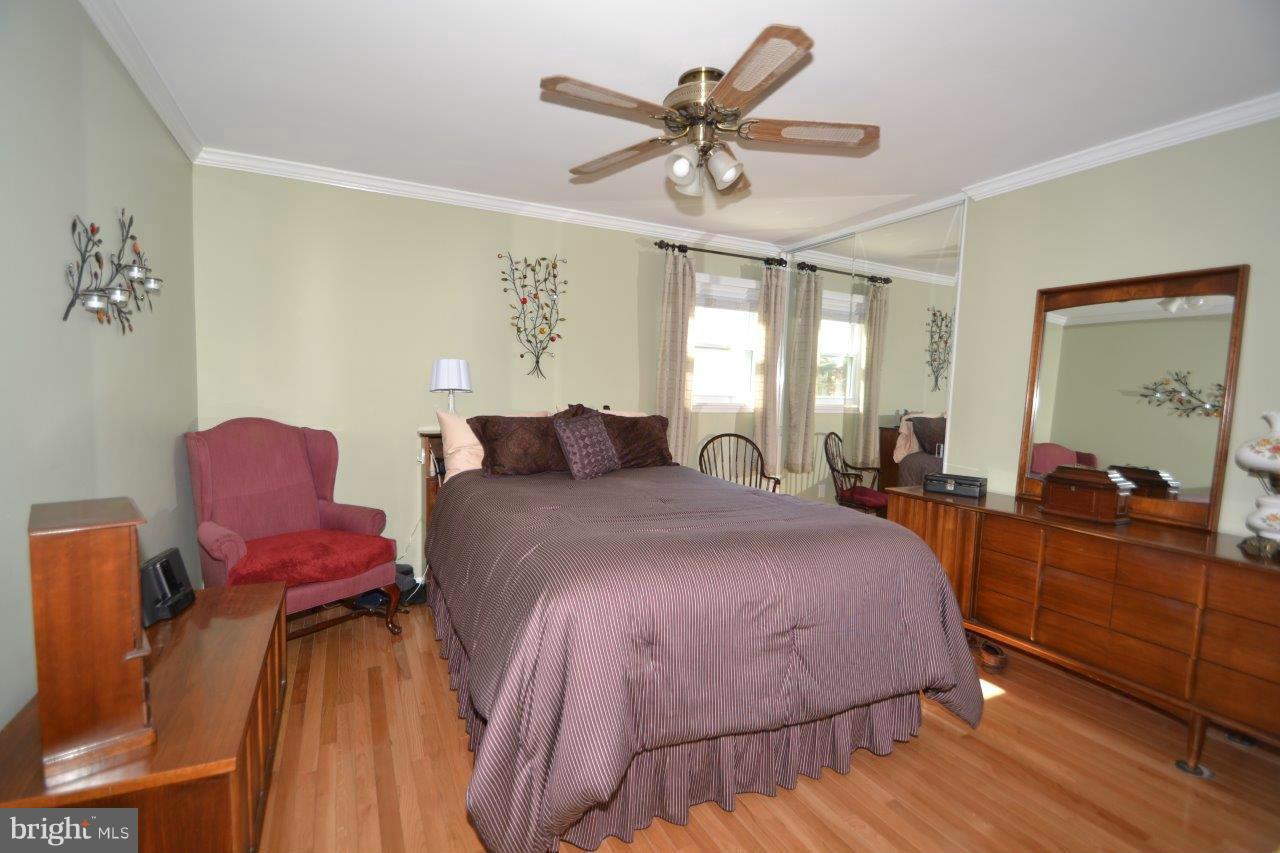 311 Bryanstone Road Reisterstown, MD 21136 - Photo 15 of 23 a bedroom with a bed and wooden floor