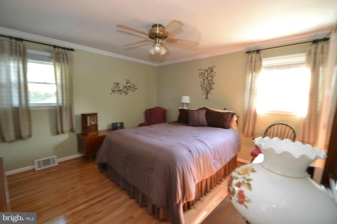 311 Bryanstone Road Reisterstown, MD 21136 - Photo 16 of 23 a bedroom with a bed and window
