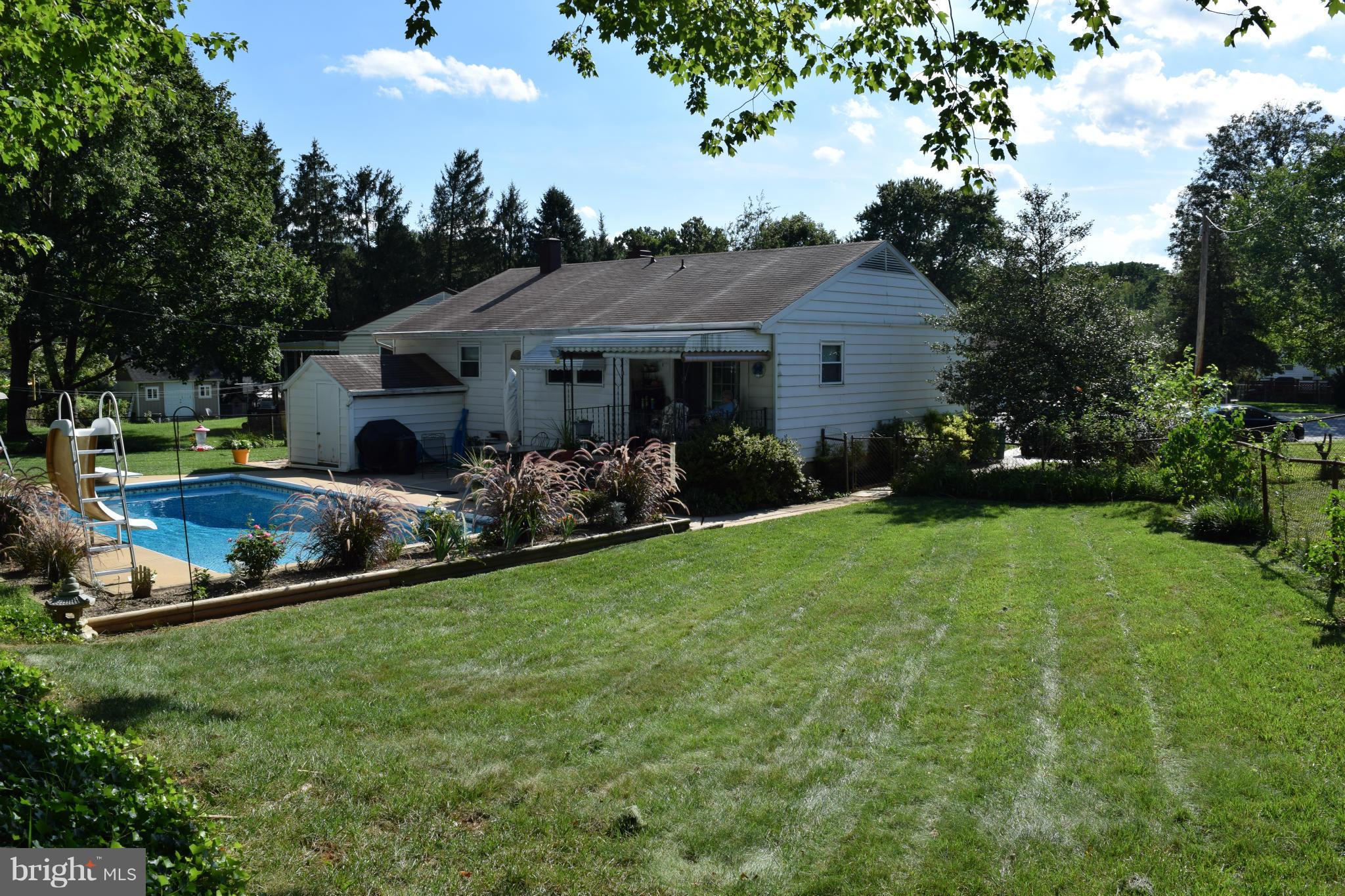 311 Bryanstone Road Reisterstown, MD 21136 - Photo 3 of 23 a view of a house with backyard sitting area and garden