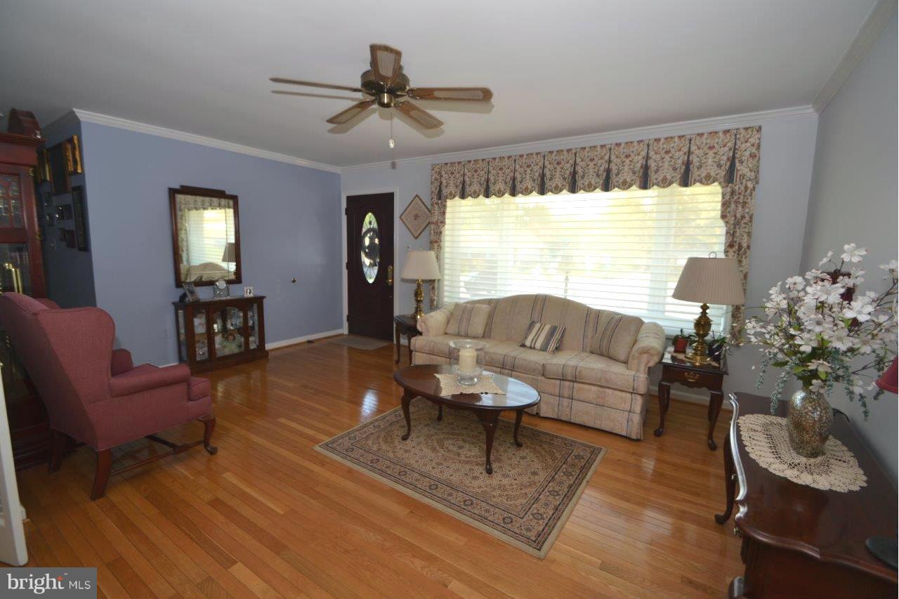 311 Bryanstone Road Reisterstown, MD 21136 - Photo 8 of 23 a living room with furniture and a large window